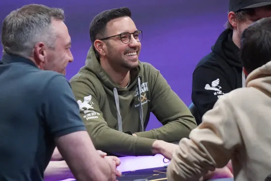 Karim Chelli with players at the poker table