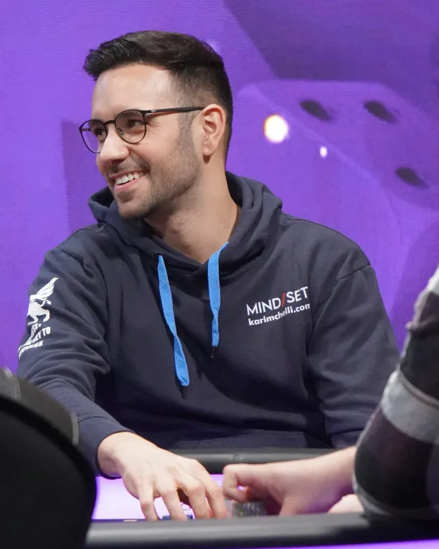 Karim Chelli at the poker table in his MIND SET hoodie